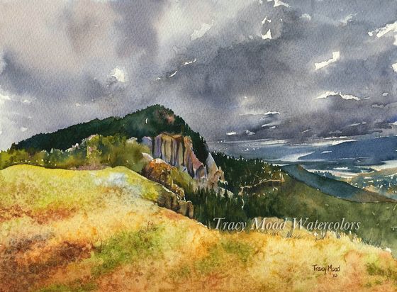 Watercolor painting of a mountain under a stormy sky, with golden fields in the foreground.