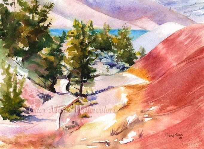 Watercolor landscape of red hills, evergreens, and blue water under a pink and purple sky.