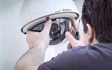 Electrician Installing CCTV — Electrical Services in Cairns, QLD