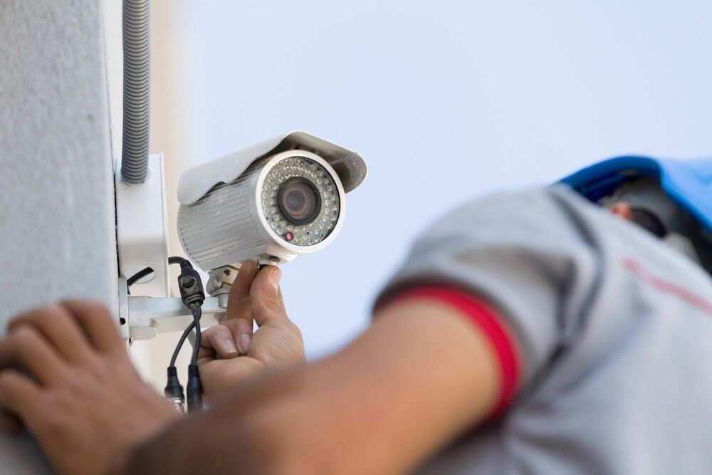 Surveillance Camera Getting Installed — Electrical Services in Cairns, QLD