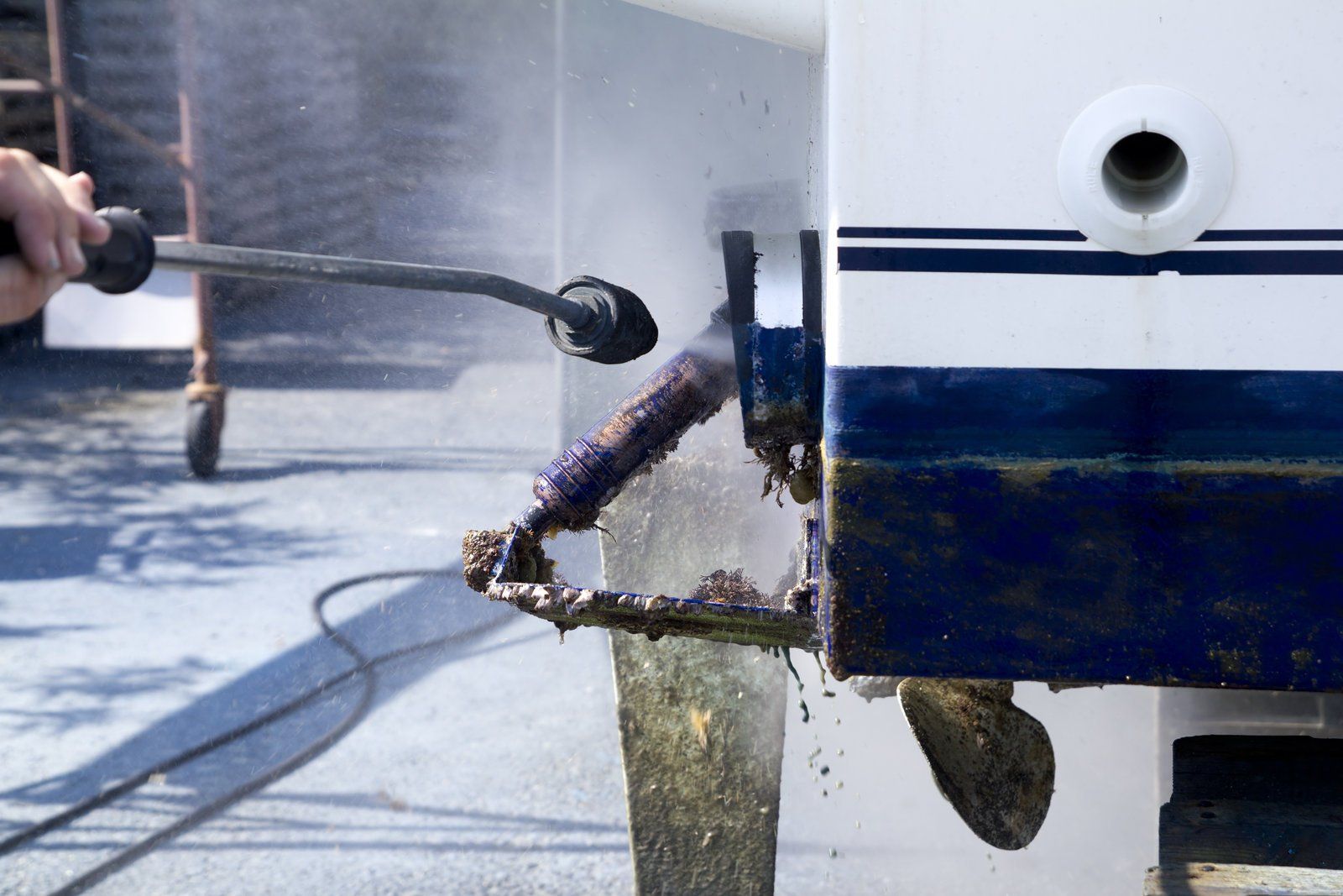 sprayer cleaning the boat