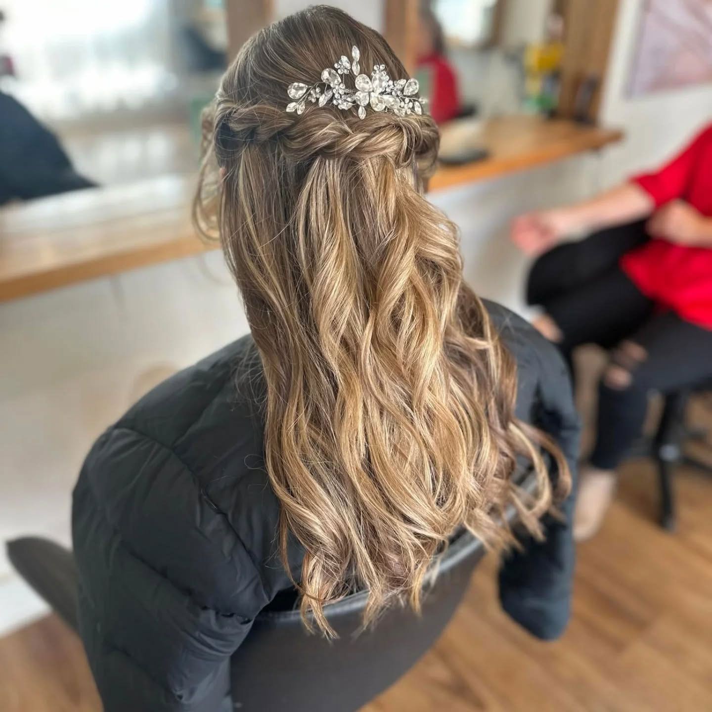 Elegant half-up bridal hairstyle with soft waves by Ballarat Hairdressers.