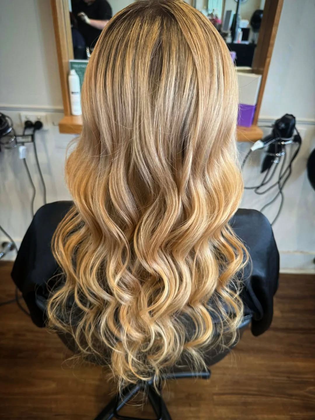 Long blonde balayage with soft waves created by Ballarat Hairdressers.