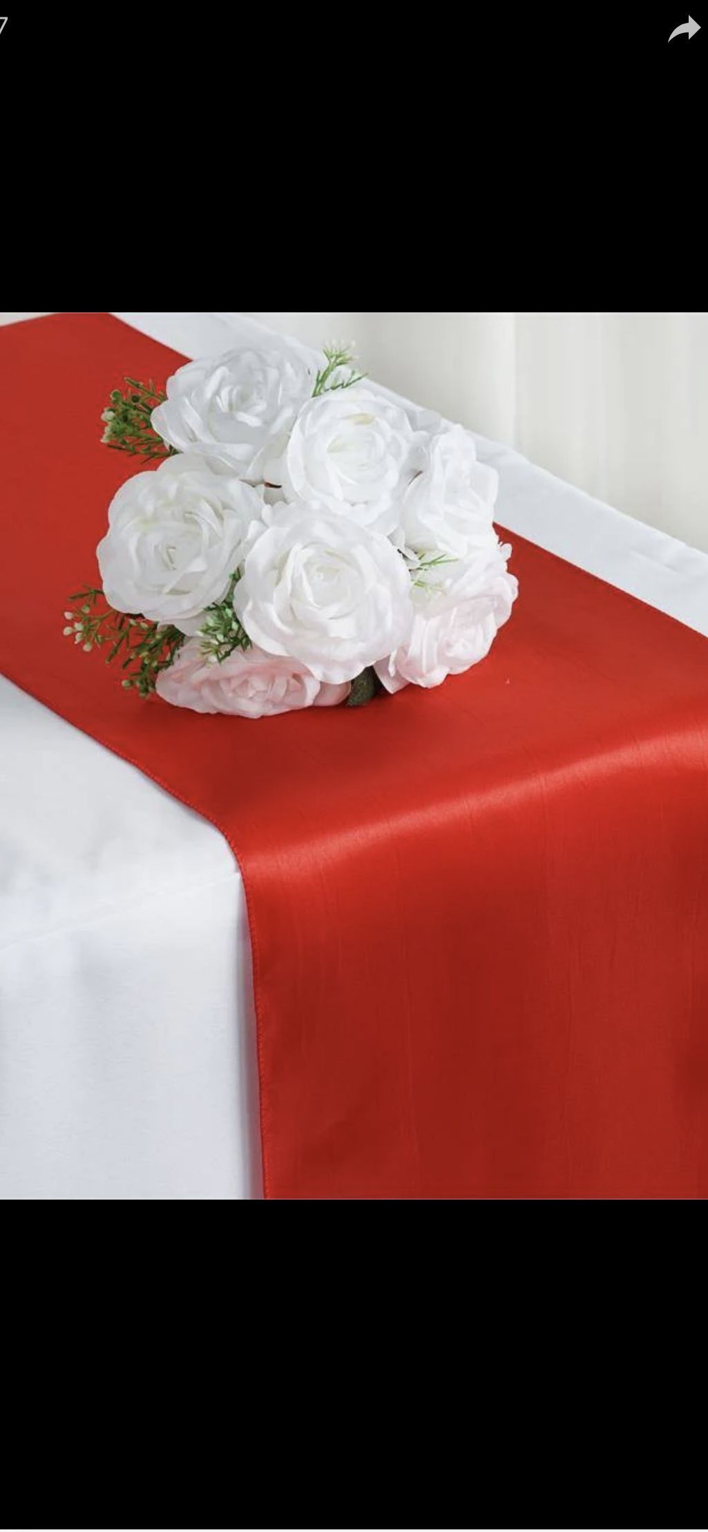 A beautifully set table with elegant tablecloths, glassware, and silverware.