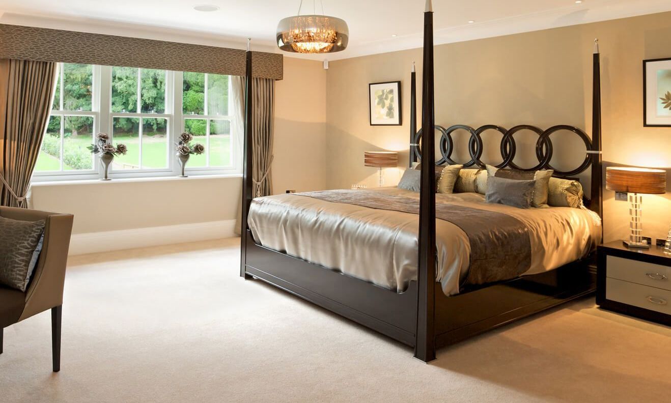 there is a four post bed in the middle of the room cleaned by Flanders Cleaning Services
