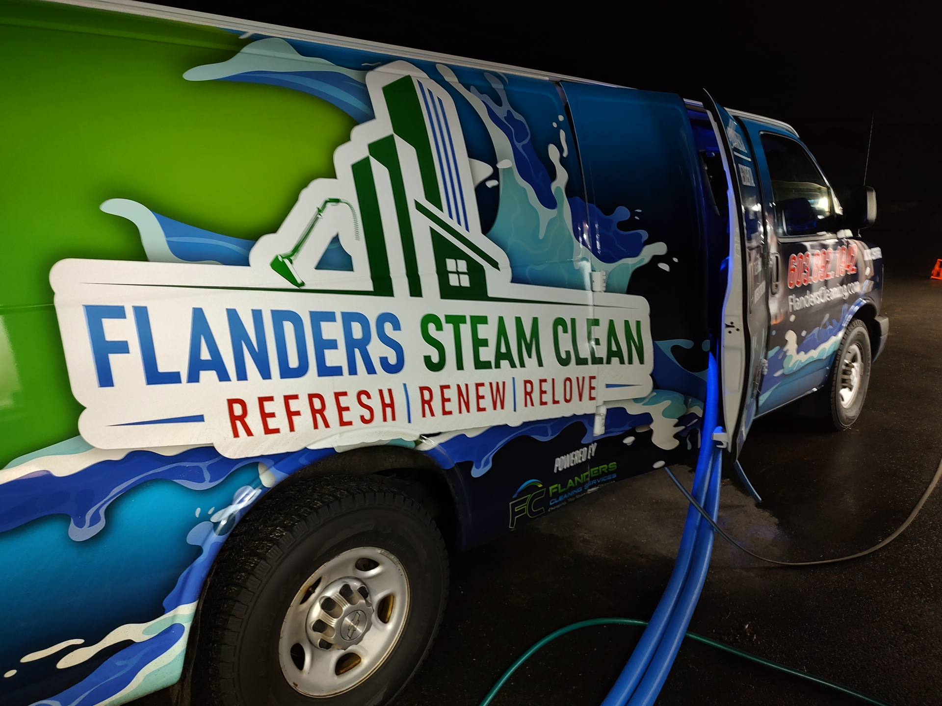A truck that says flanders steam clean on the side