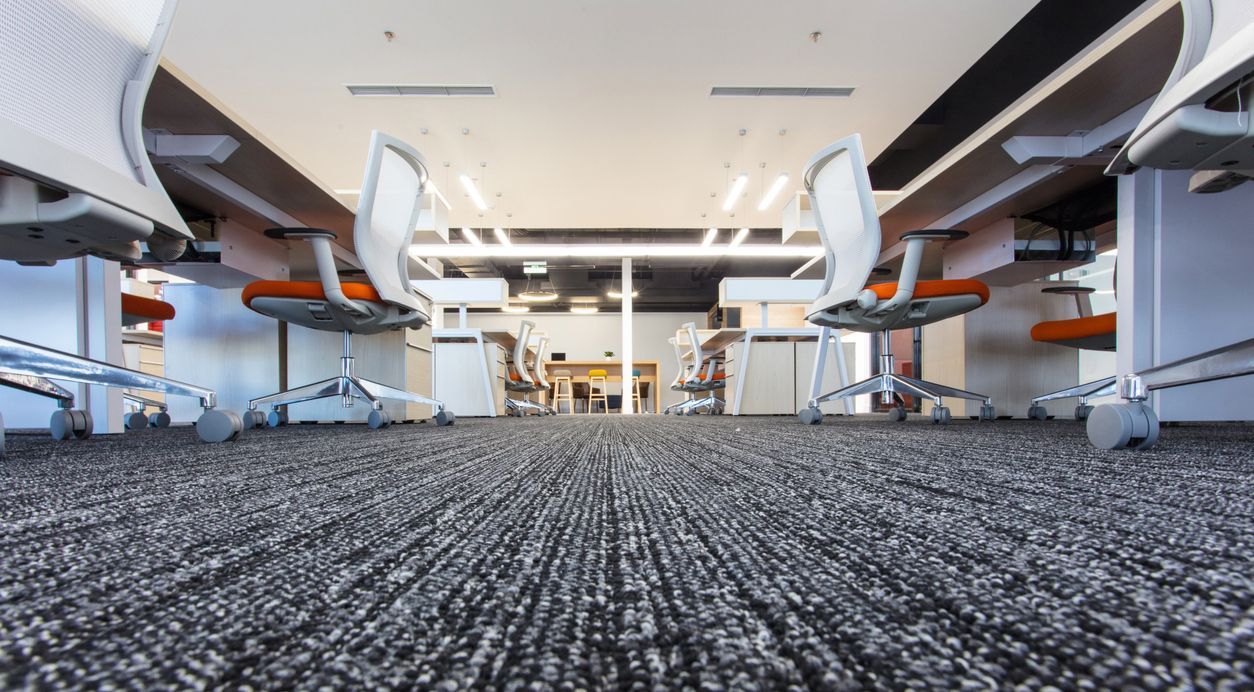 Office cleaning services image of a corporate office desks and carpet