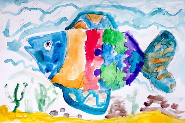 A child 's painting of a colorful fish in the ocean