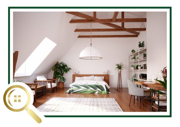 Bright airy bedroom with wooden beams, white pendant light, plants, and a desk near a skylight.