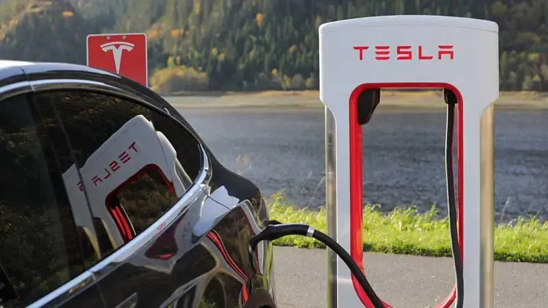 Tesla electric car charging at a Supercharger station outdoors