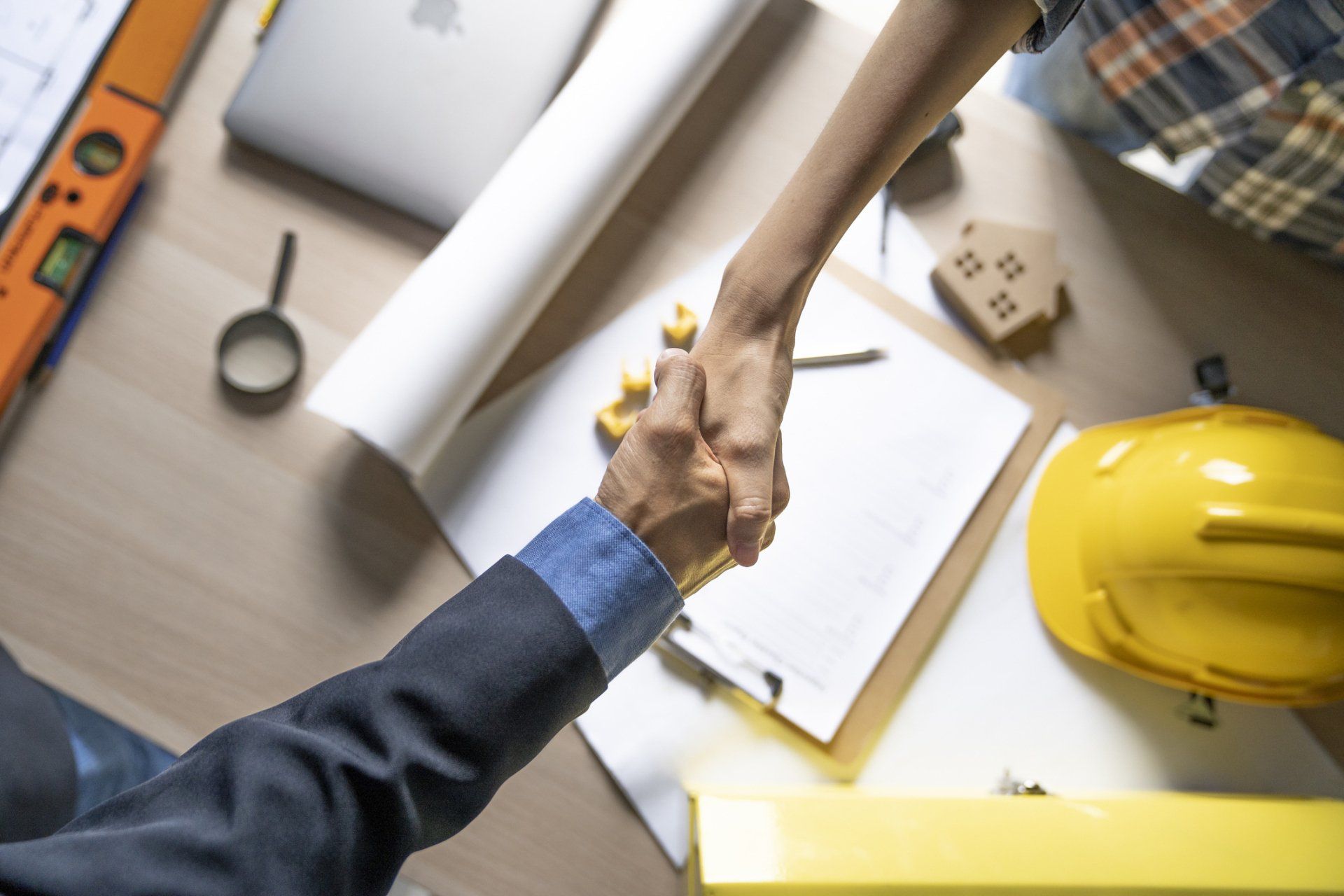 A Business Man Having An Agreement With A Construction Worker — Seattle, WA — American Business & Personal Insurance, INC.