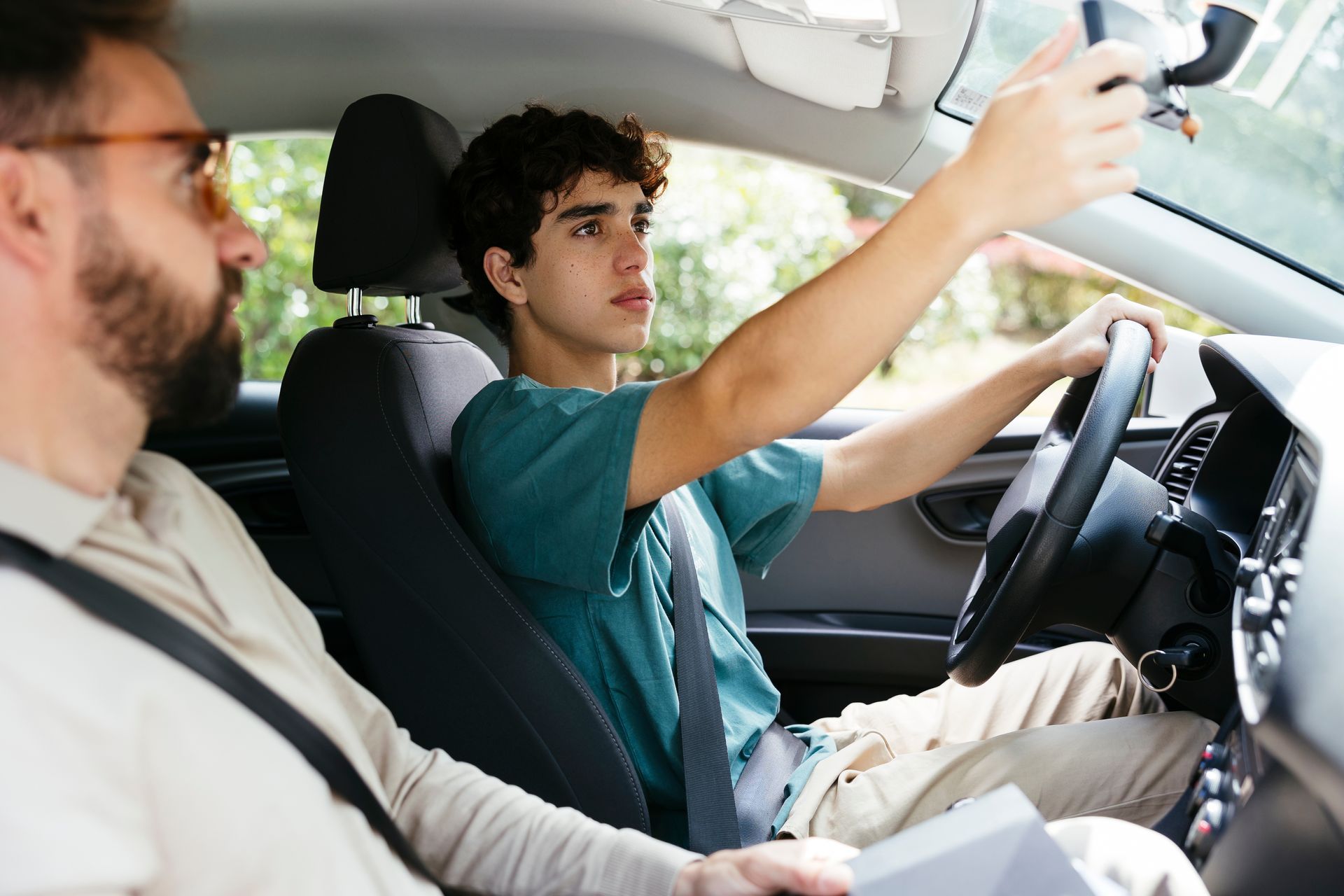A teen is learning to drive.