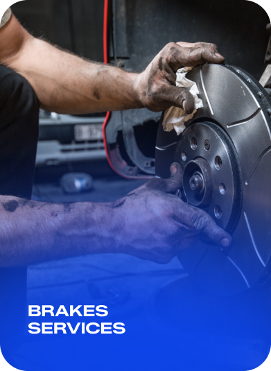 Mechanic working on a car brake disc, with “Brakes Services” text on blue banner | AACCEL Emissions & Auto Repair Specialists