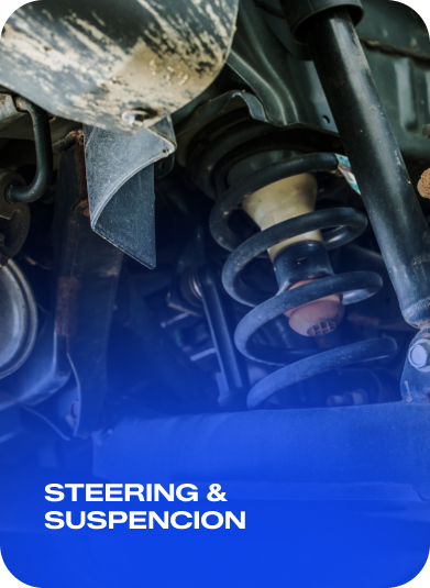 Close-up of a car suspension coil spring with the text “STEERING & SUSPENSION” on a blue banner. | AACCEL Emissions & Auto Repair Specialists