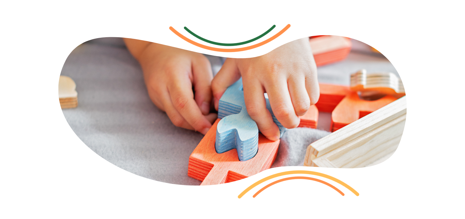 A child is playing with wooden blocks on a table.