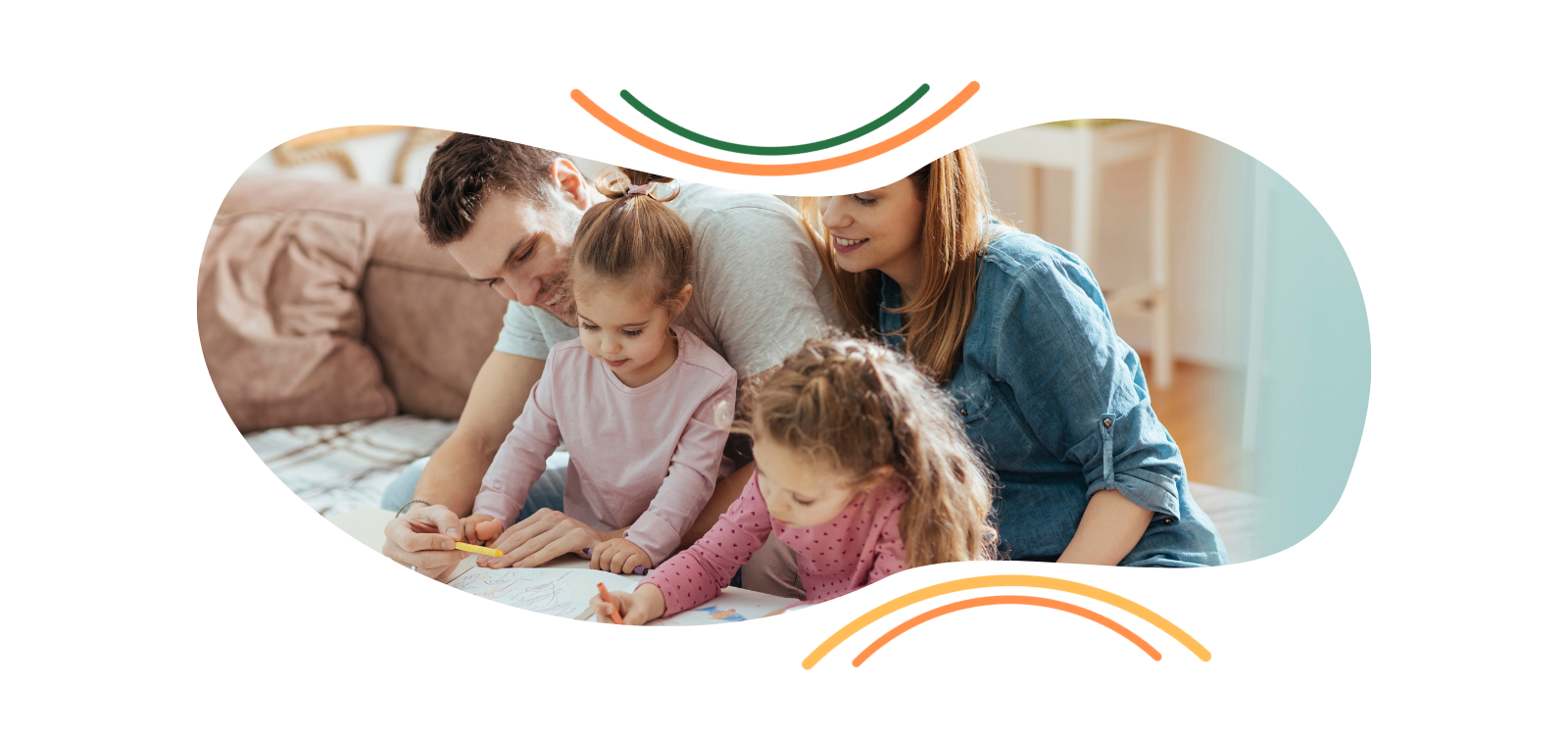 A family is sitting on a bed reading a book together.