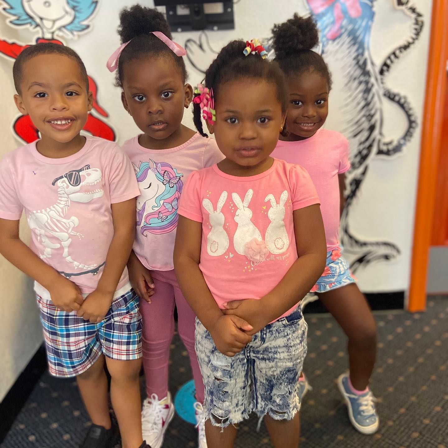 A group of young girls are posing for a picture