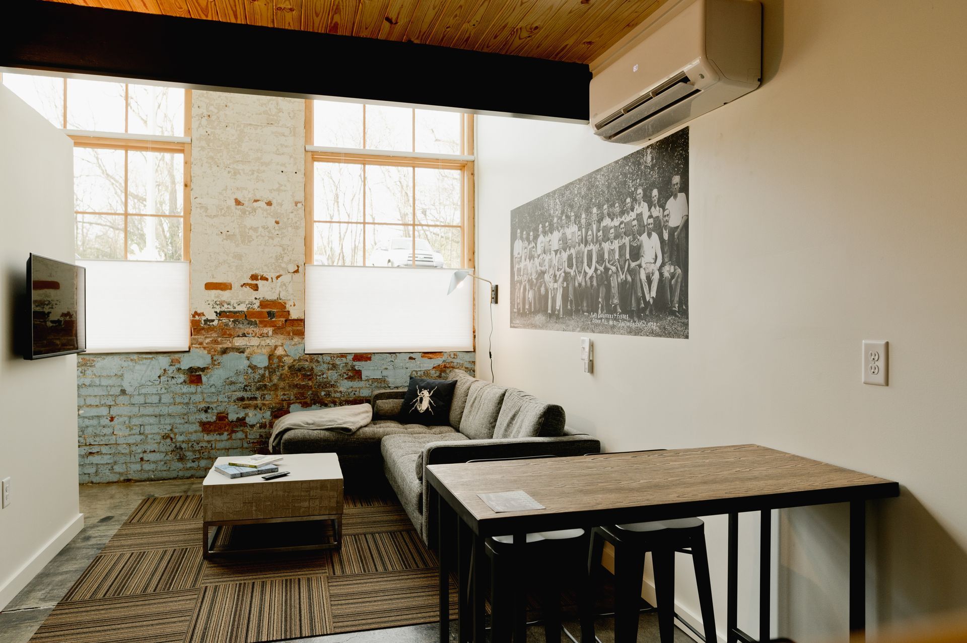 Wide shot of double volume loft historic hotel living room