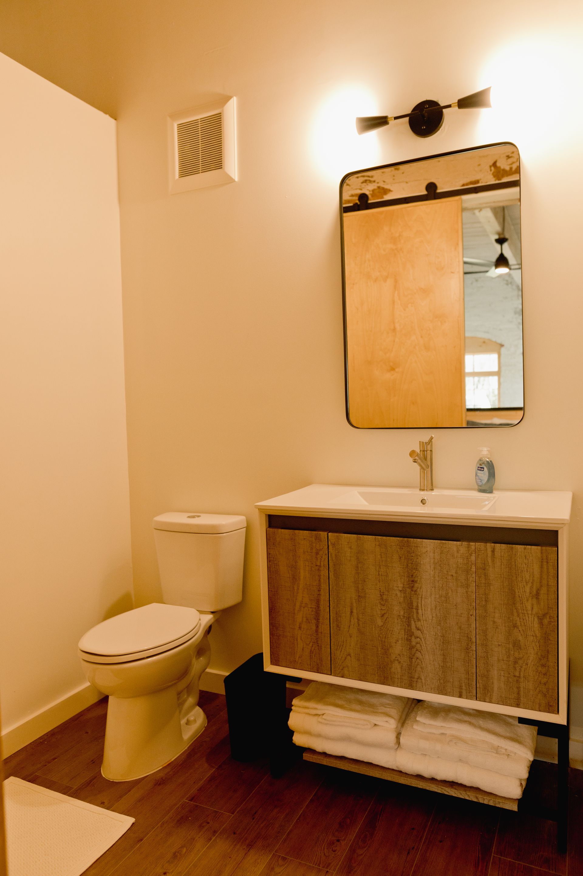 Boutique hotel bathroom with large mirror