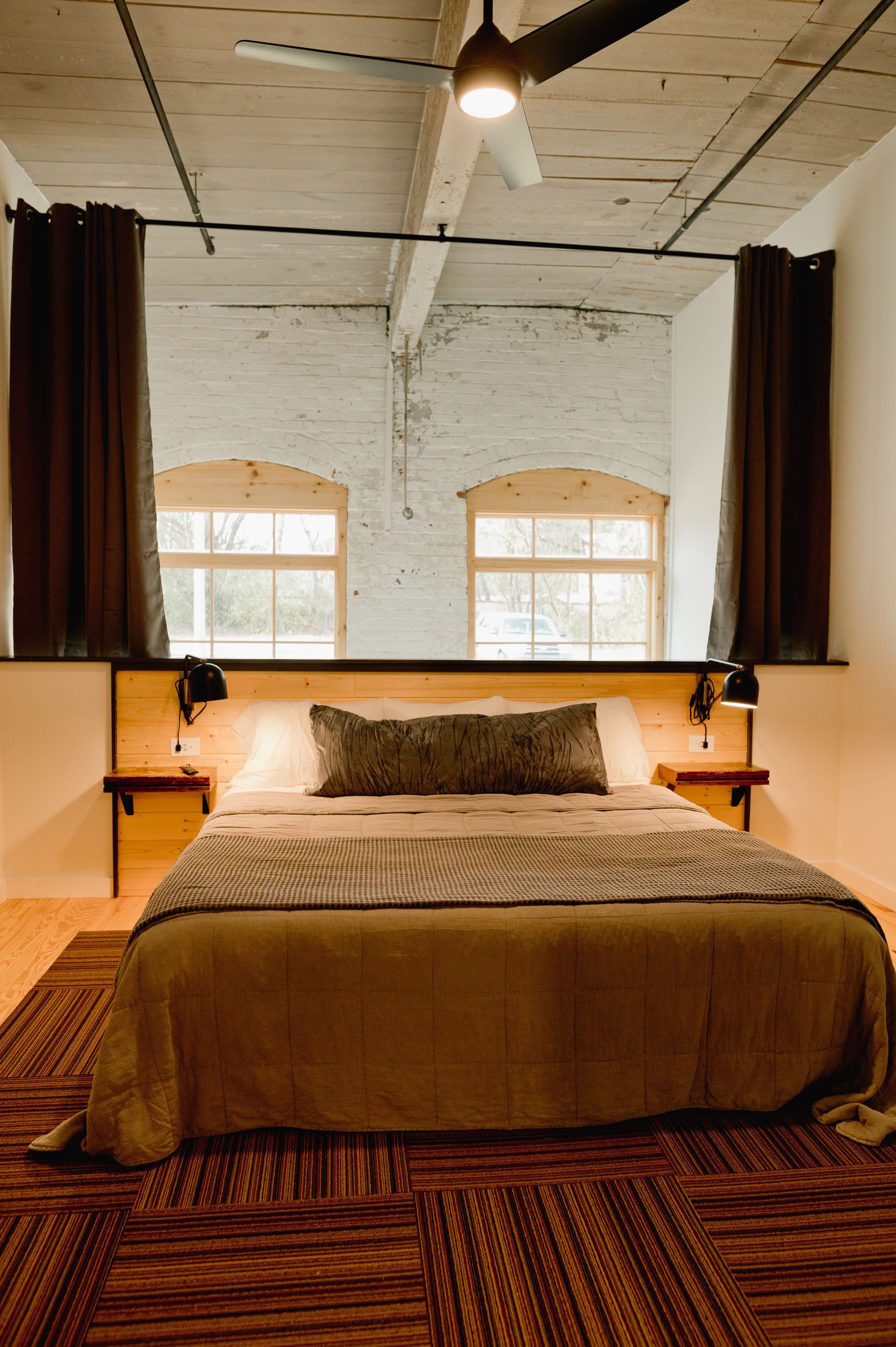 Loom Room boutique hotel bedroom with queen bed