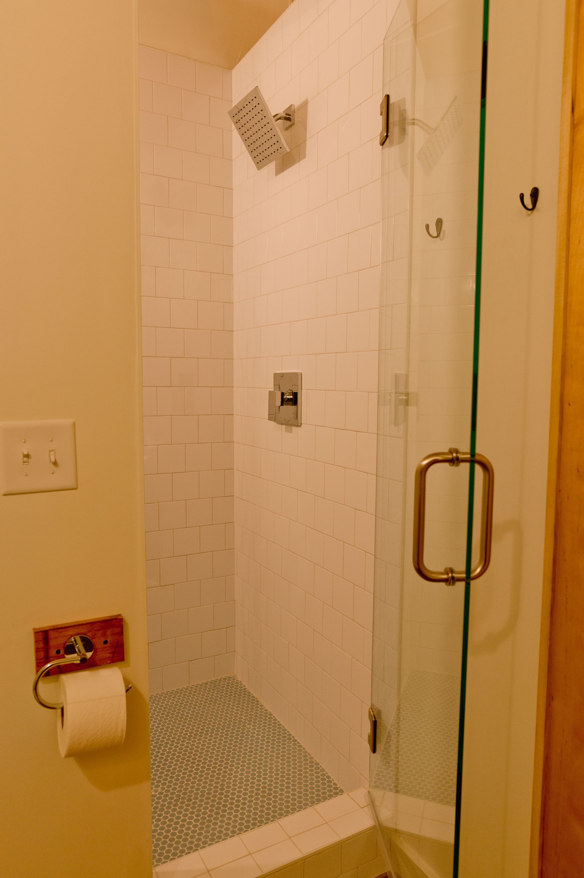 Newly renovated walk in tile shower in every suite