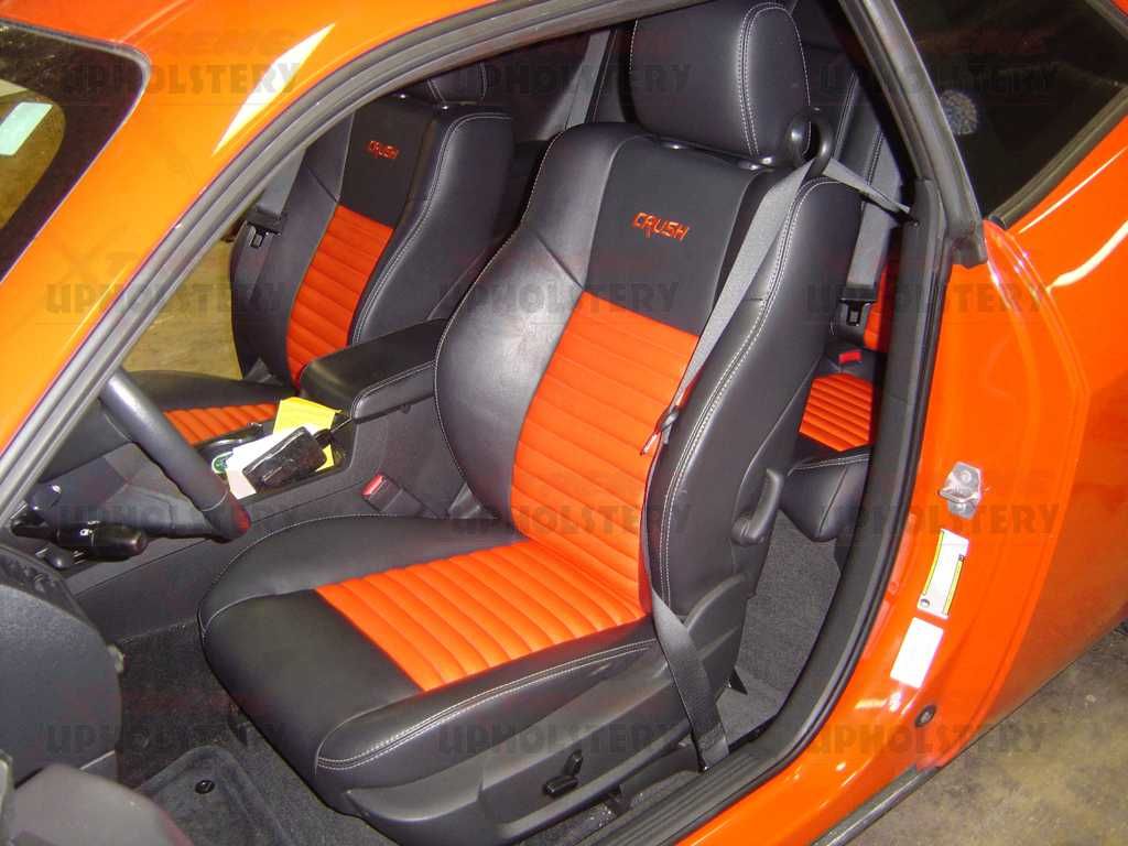 Orange sports car interior with black and orange racing seats and open door