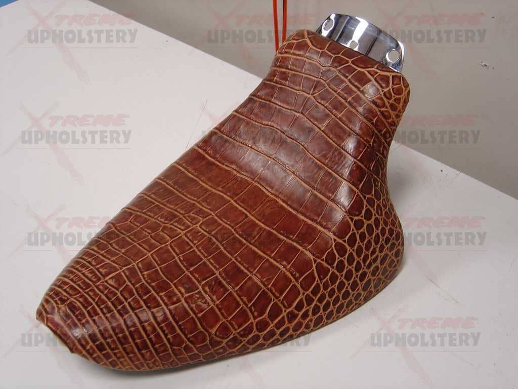 Brown crocodile-pattern leather chair leg cover with a chrome top fitting