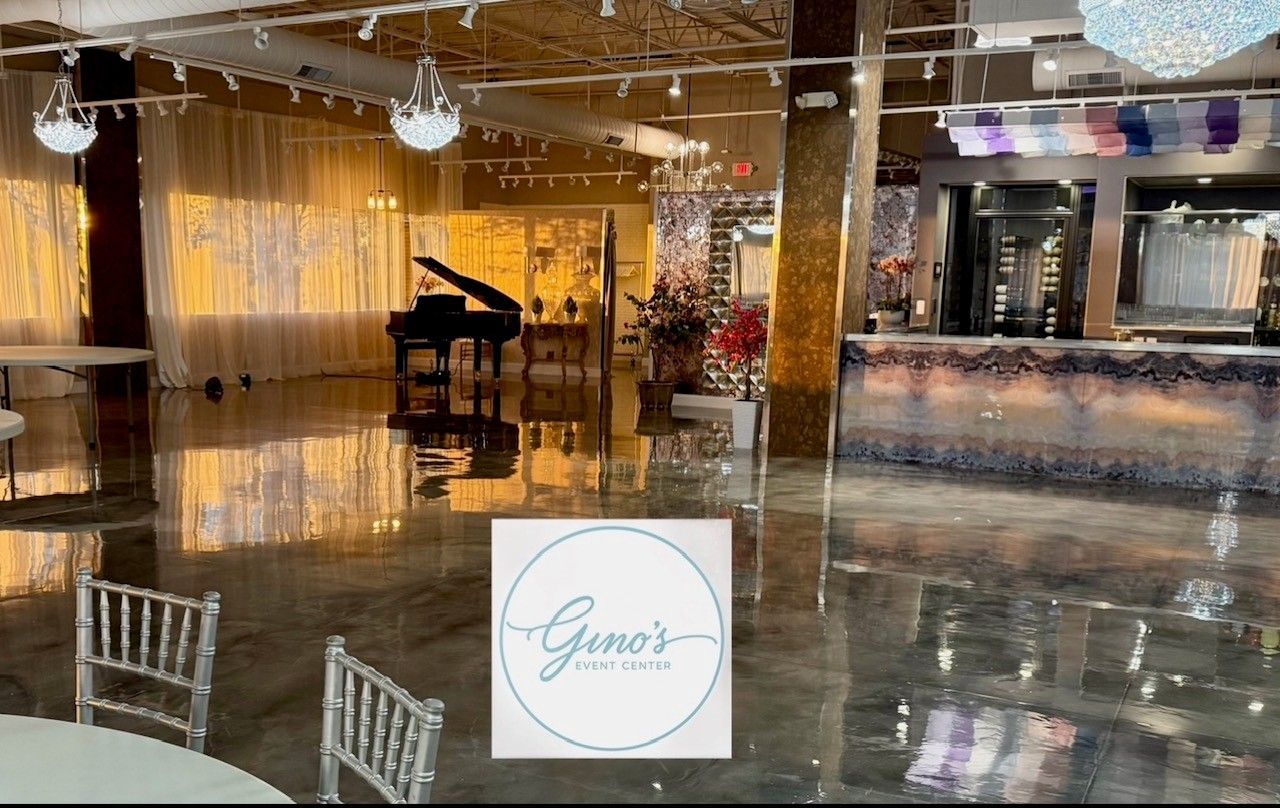 Interior with grand piano, ornate chandeliers, and elegant furnishings.