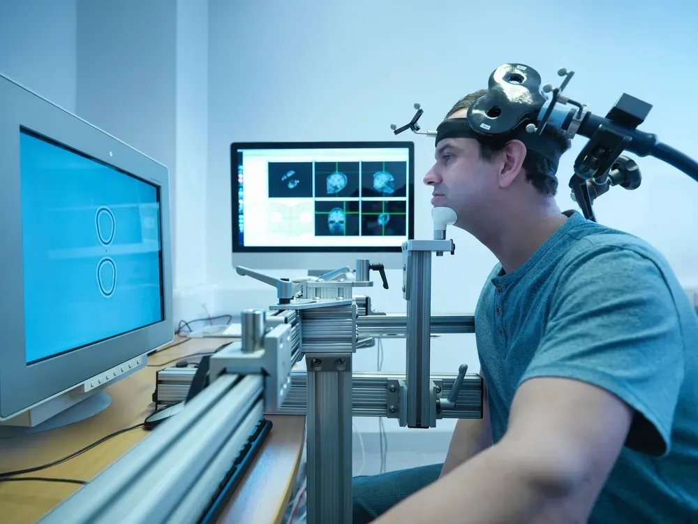 A man undergoing TMS treatment.