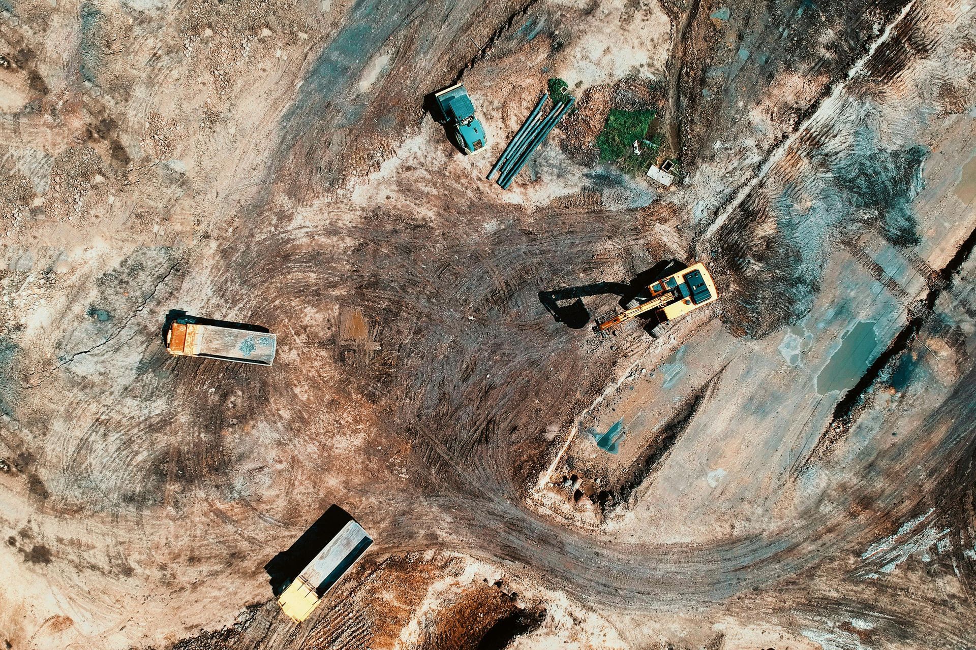 Trucks clearing the land to prepare for construction