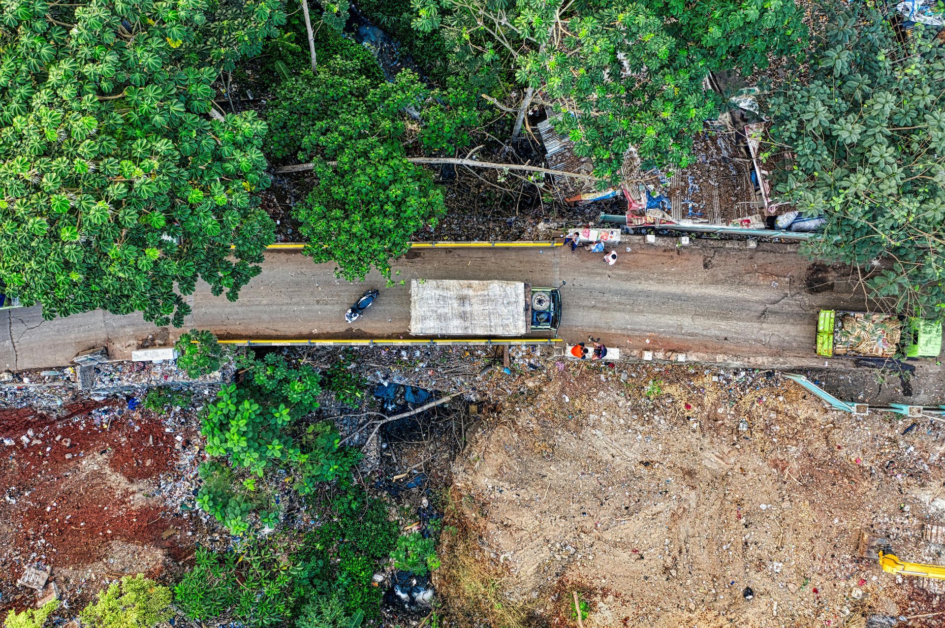 A truck is going to the development site to help with the land clearing