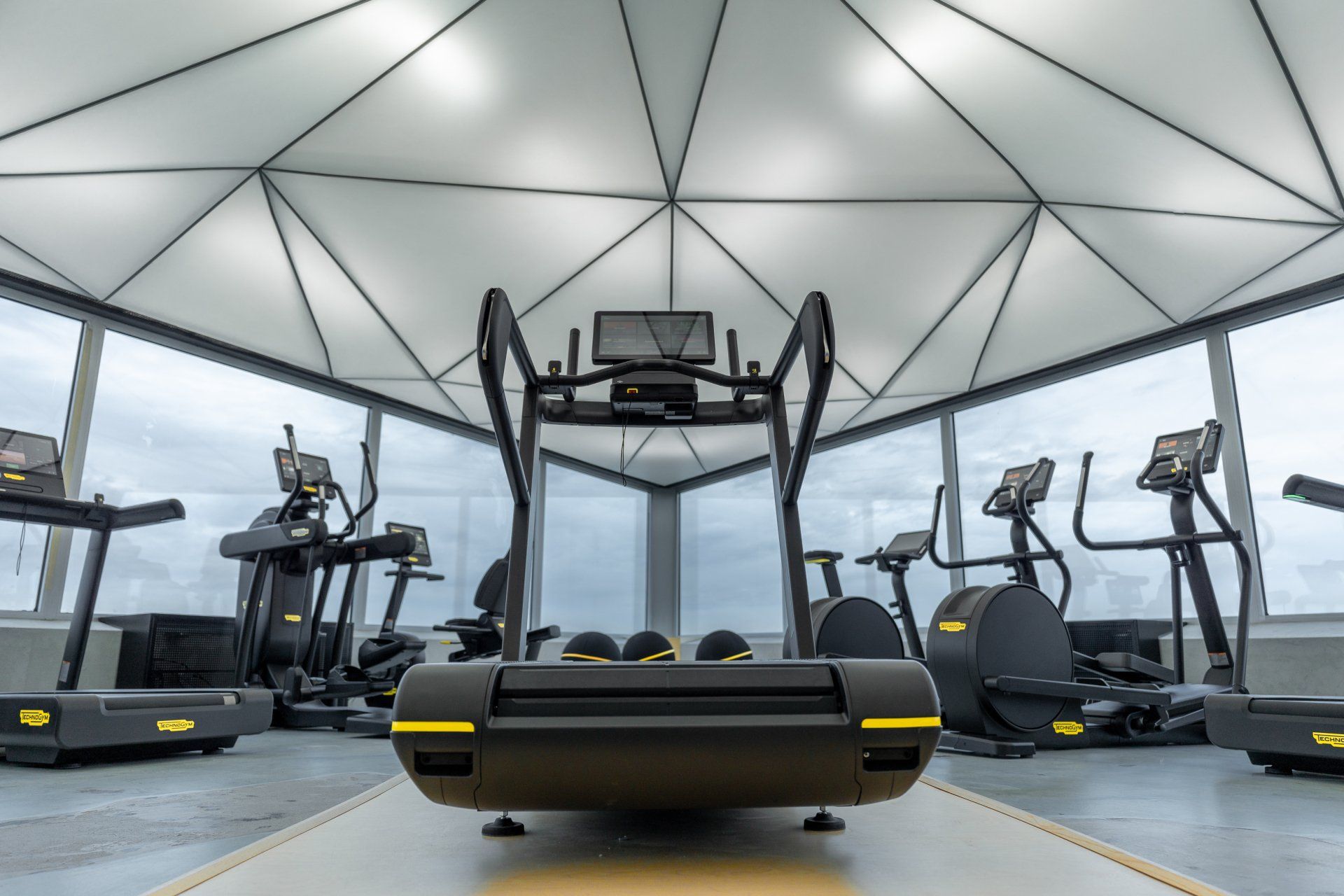 a SkillRun treadmill is sitting in the middle of a gym .