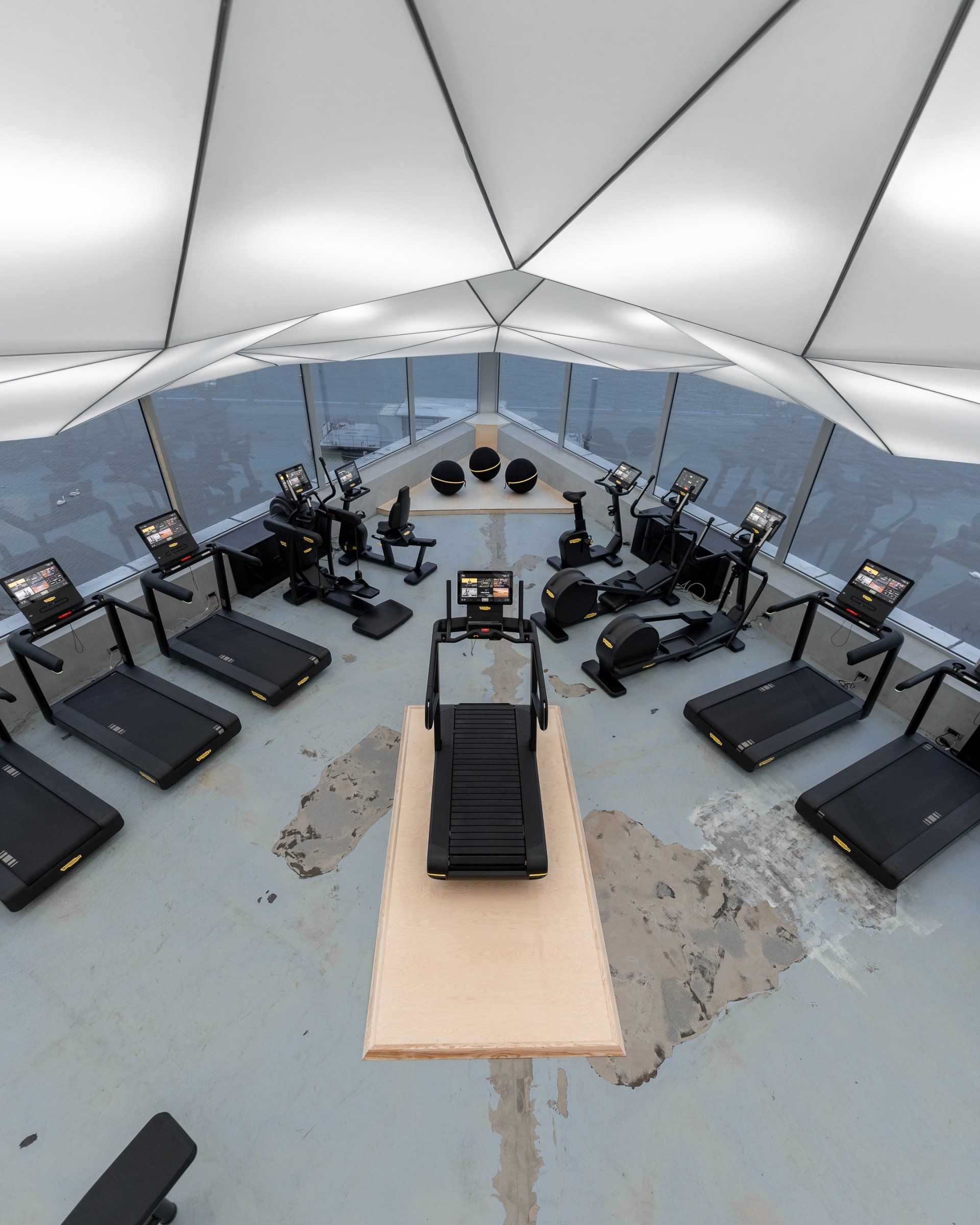 a gym filled with technogym treadmills and exercise bikes