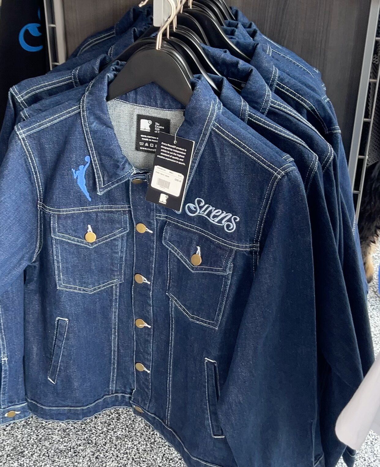 Cleveland Sirens denim jacket displayed inside the Center Court merchandise pop-up.