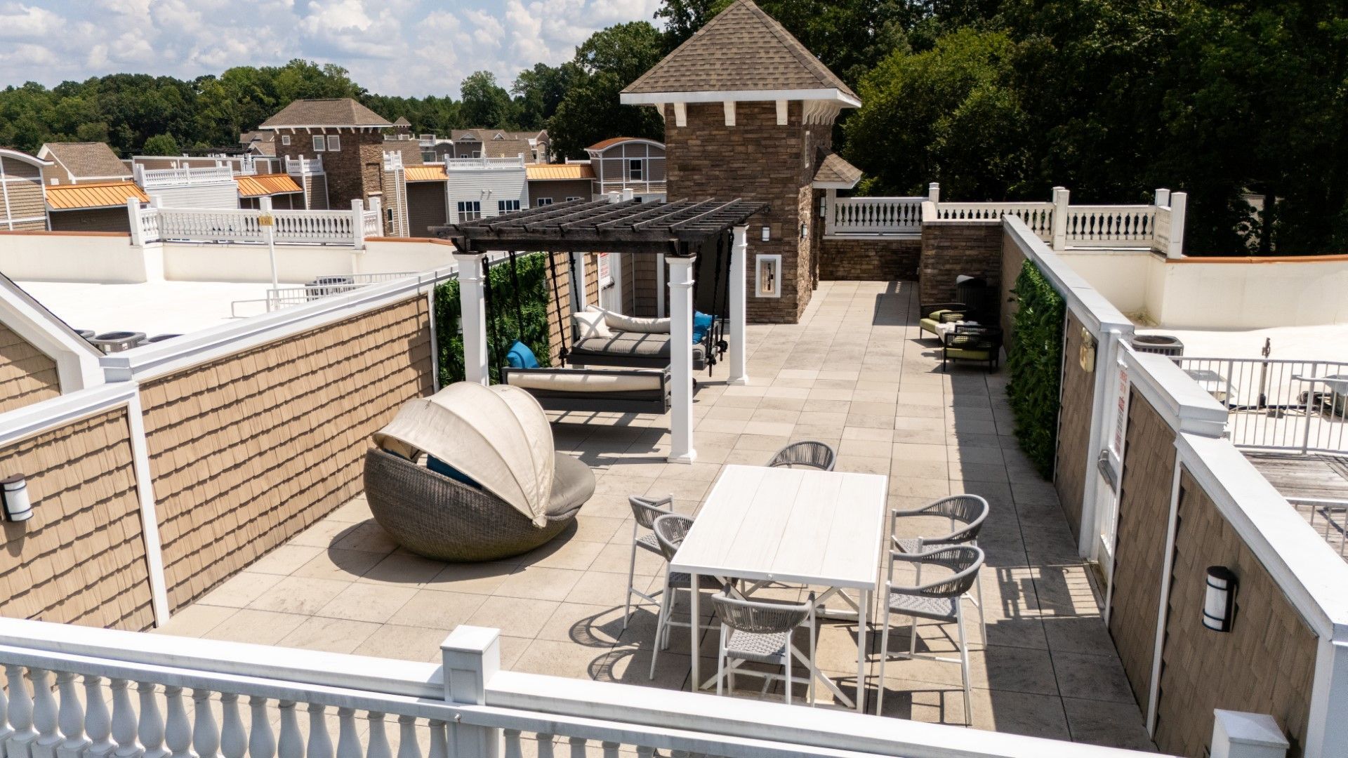 A patio with a table and chairs under a pergola