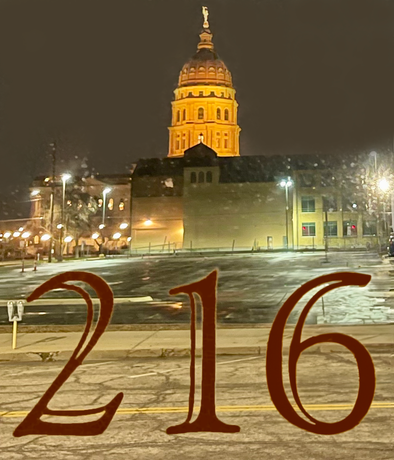 A large building with the number 216 in front of it
