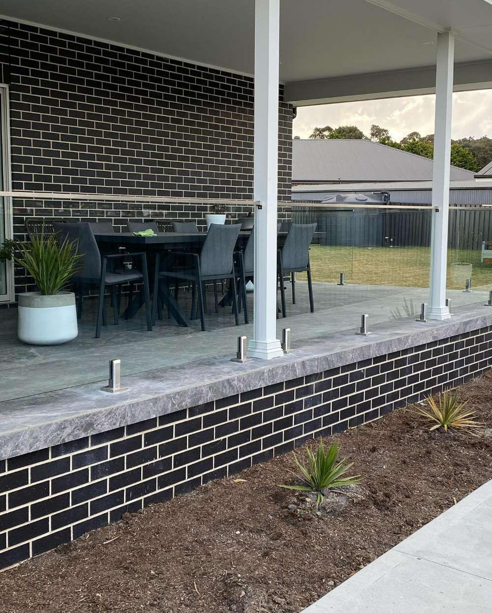 A Deck With a Table and Chairs on It — All Things Windows & Doors in Goulburn, NSW