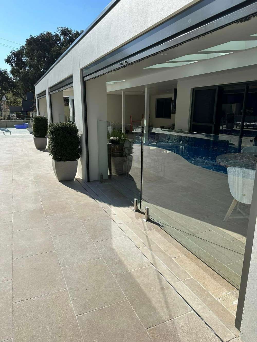 A Large House With a Swimming Pool — Bespoke Doors & Windows in Goulburn, NSW