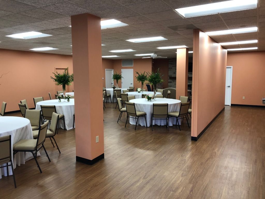 A large room with tables and chairs in it