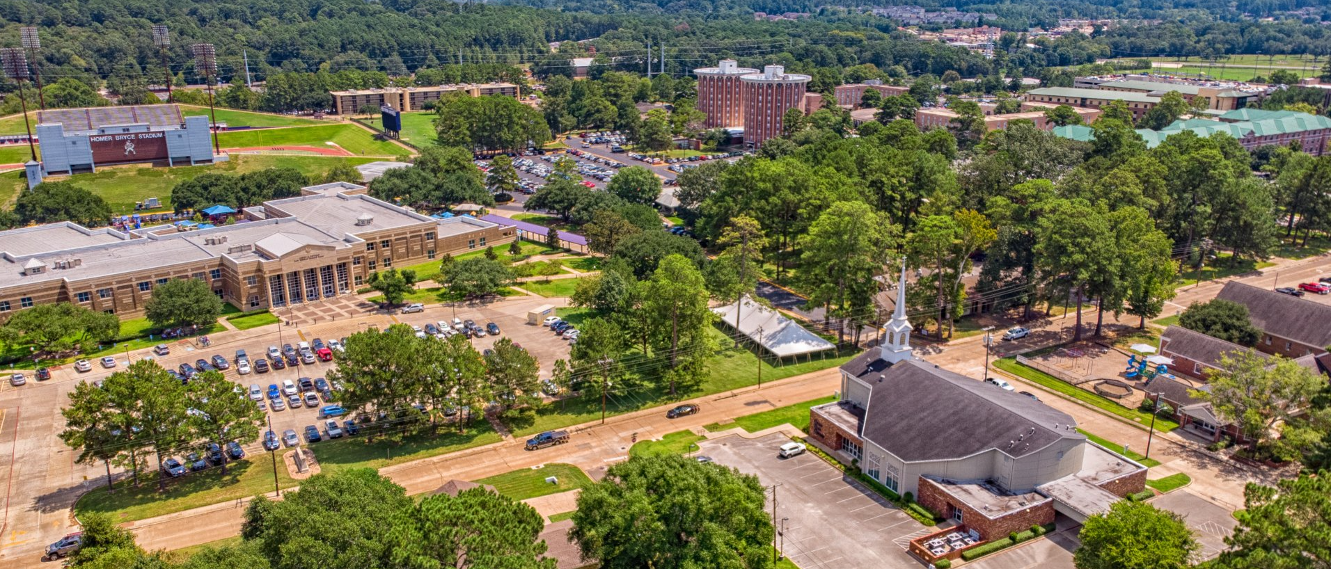 Aerial view of the location of GBC relative to the SFASU campus. Lush greenery surrounds the structures.