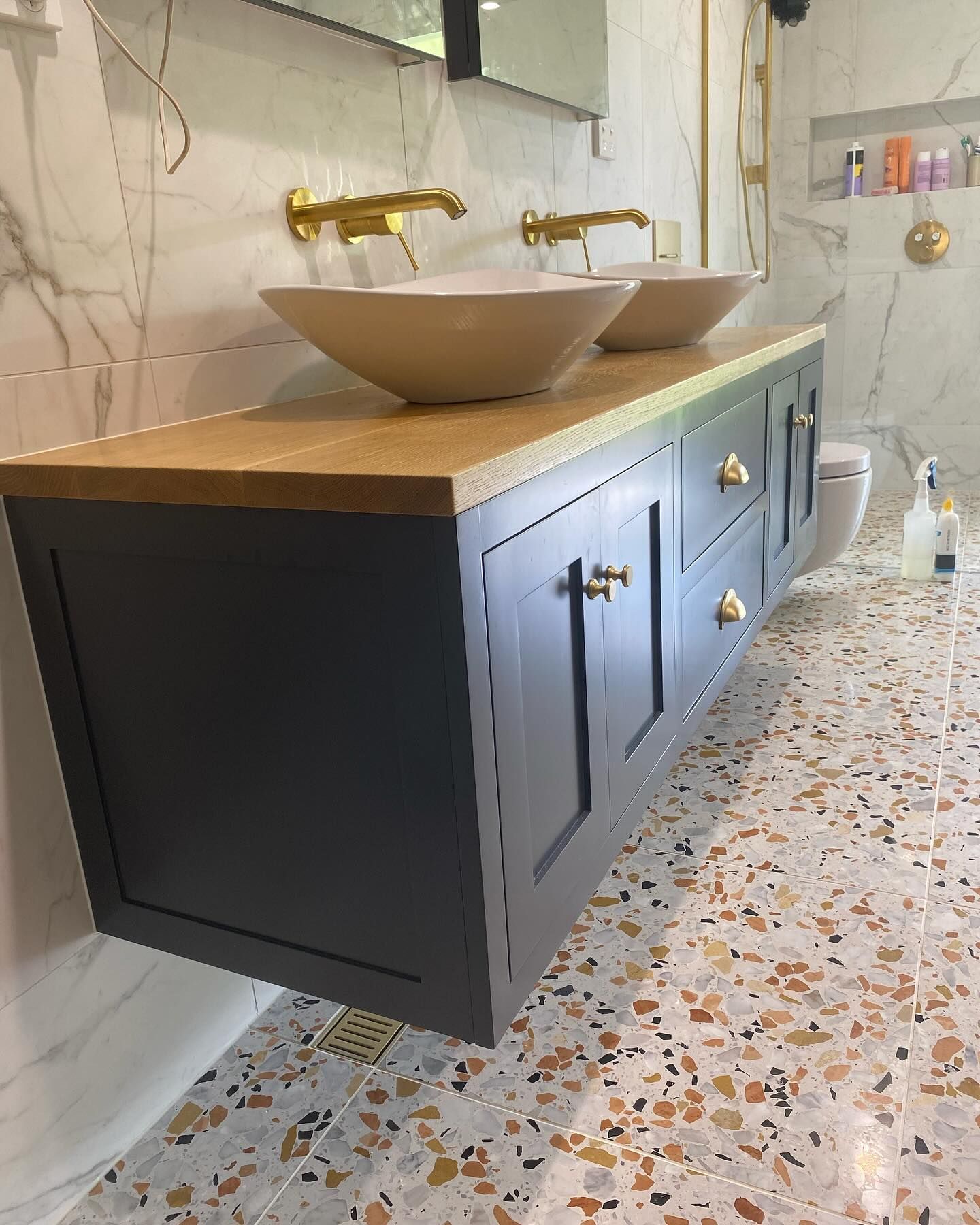Dark gray floating bathroom vanity with wood countertop — BC Customs in Burrell Creek, NSW