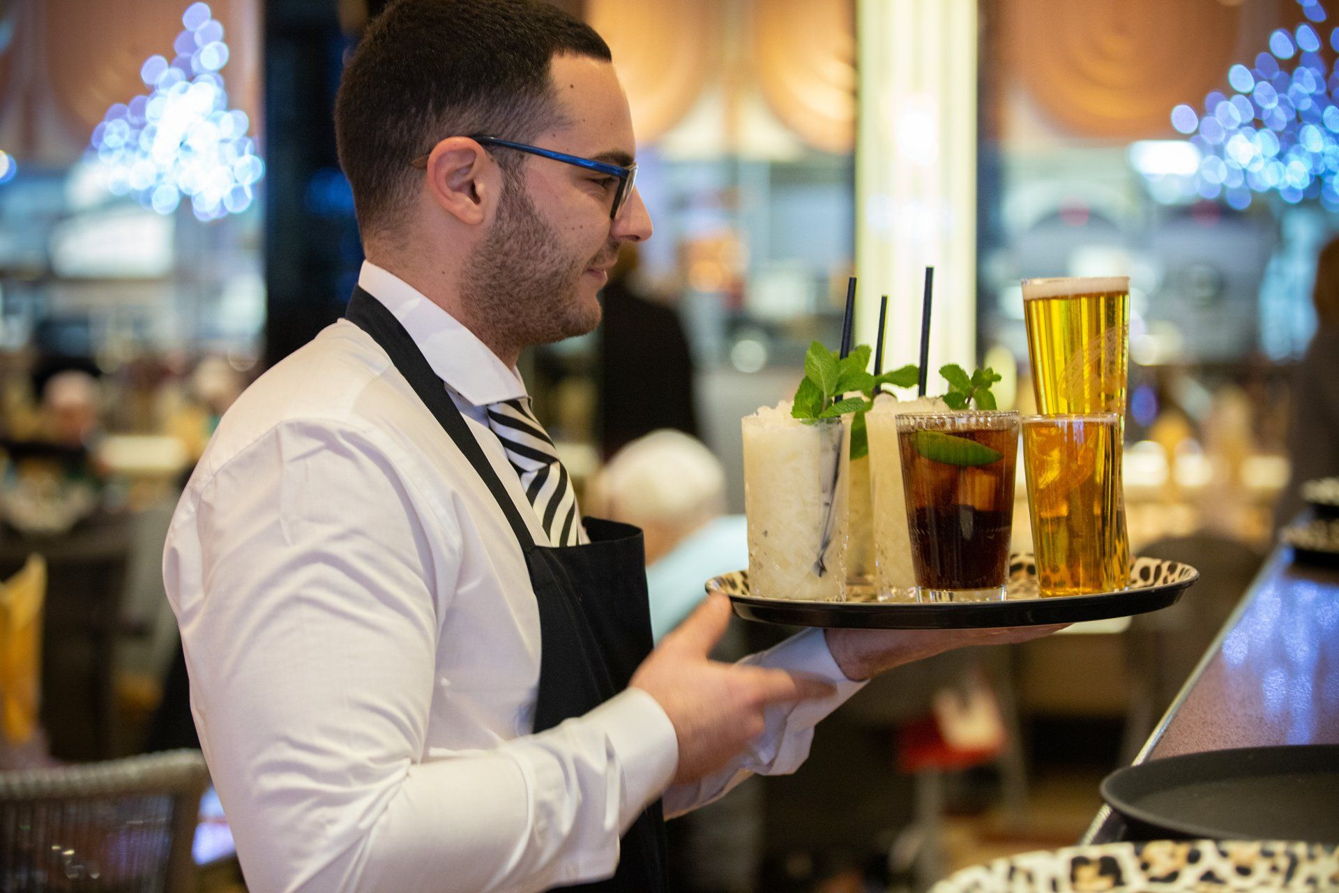 Event photo waiter with drinks at Bibis Restaurant in Leeds