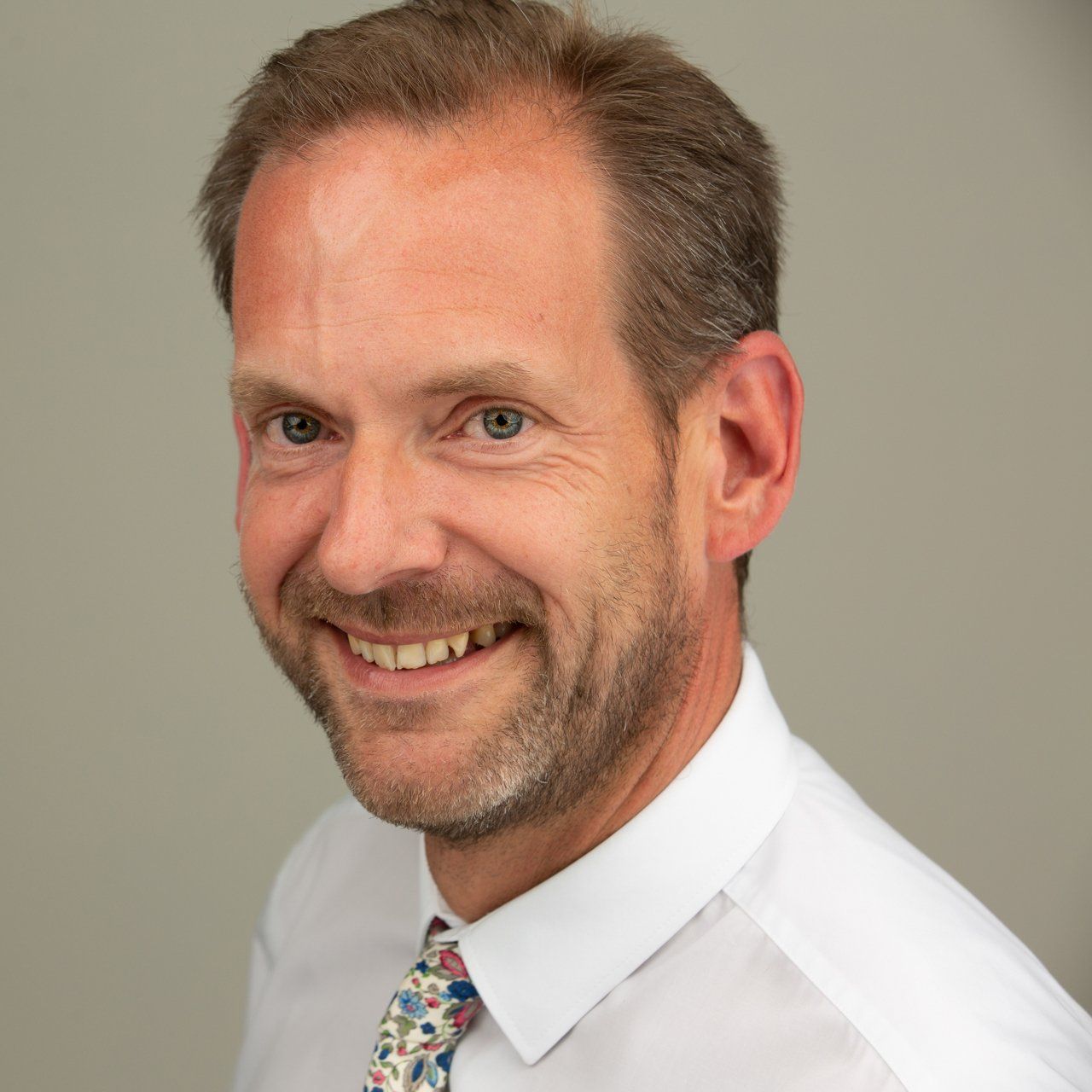 Headshot taken in Leeds photography studio of dark haired man with beard