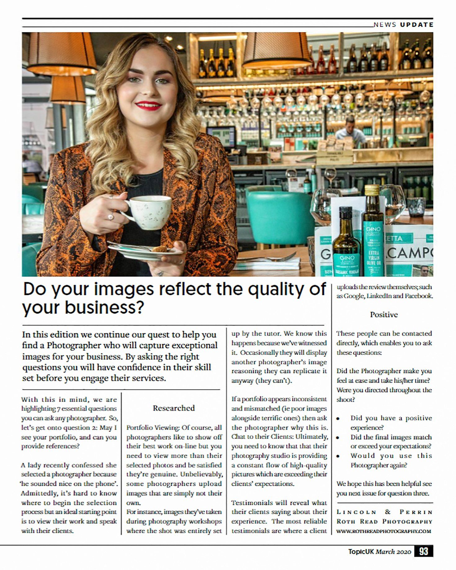 A woman is holding a cup of coffee in a restaurant.