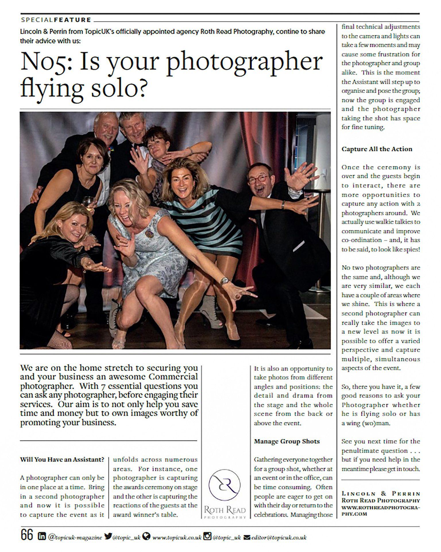 A group of people are posing for a picture in a newspaper article.