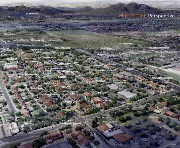 Aerial view of a sprawling suburban neighborhood with streets, houses, and mountains in the distance