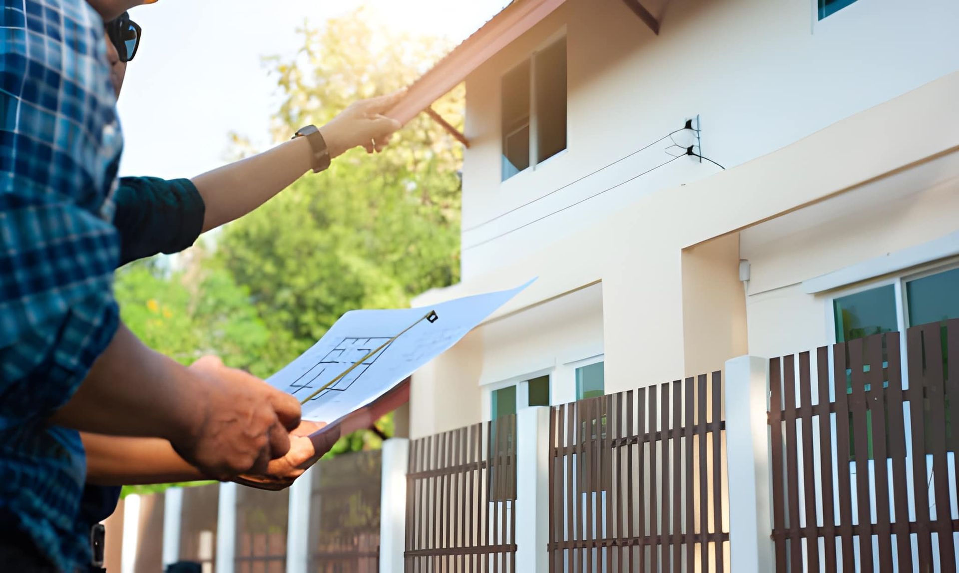 Home inspector and client reviewing blueprints—Palm City FL residential inspection and planning