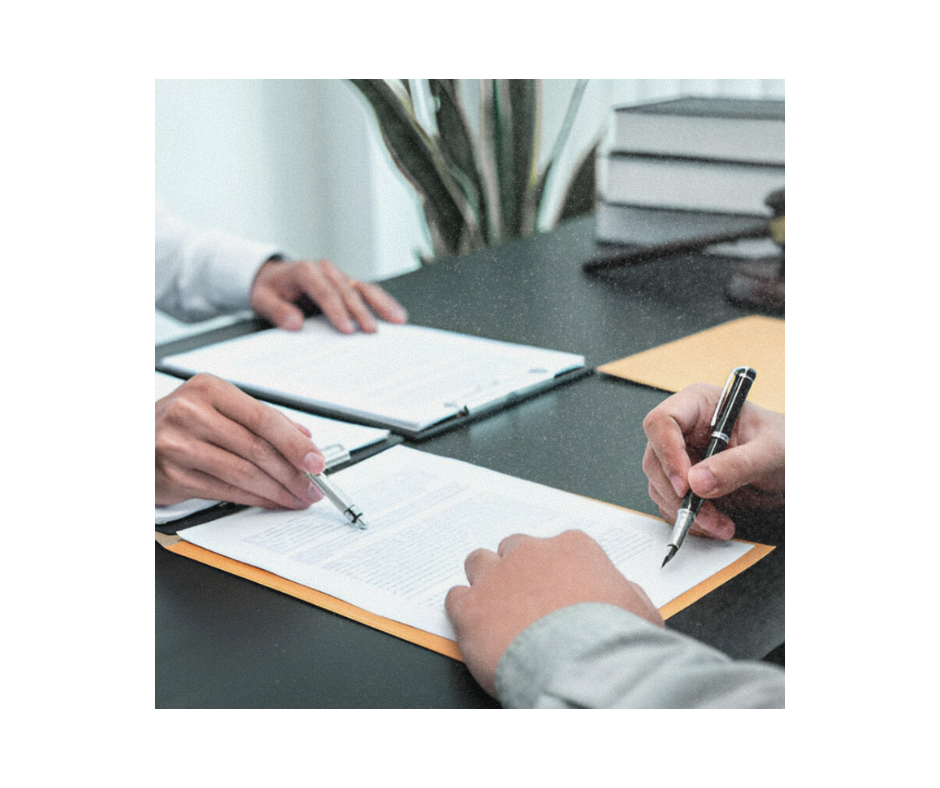 Male claims intermediary officer discussing claims case with a client in a meeting.