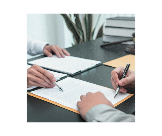 Male claims intermediary officer discussing claims case with a client in a meeting.