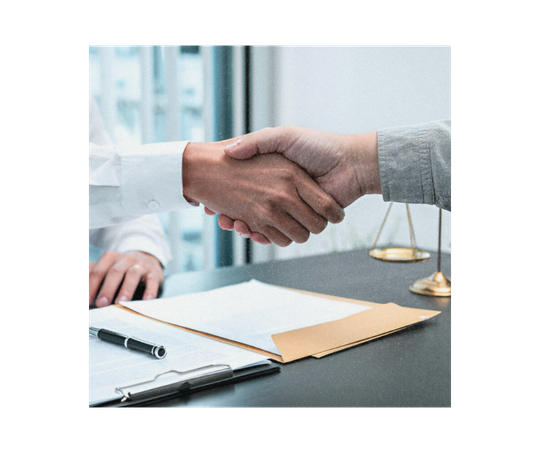 Male claims officer shaking hands with client after good deal negotiation.